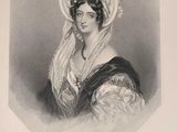 an old black and white photo of a woman wearing a hat