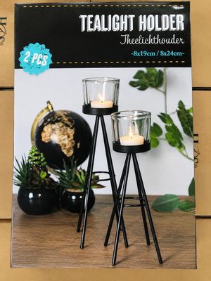 two candles that are sitting on a table