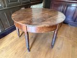 a wooden table with a wooden top on a hard wood floor