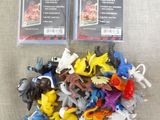 many different types of plastic toys on the table