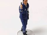 a figurine of a man with a gun in his hand