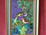 tableau représentant deux oiseaux perchés sur une branche dans un décor tropical