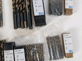 many different types of drill bits on the table