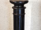 a black pole that has a black top and a black base