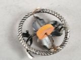 a bird that is holding an umbrella inside of a ring