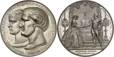 two silver coins with a portrait of a man and a woman on them