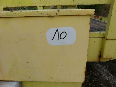 a sign that says no on the side of a yellow truck