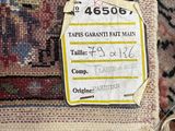 an image of a carpet with a tag on it that says tapes ganti fart main