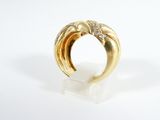 an image of a gold ring with diamonds on a white surface