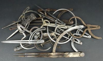 a pile of old tools that are on a table
