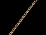 a close up of a gold chain bracelet on a black background