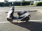 a scooter that is parked in the parking lot