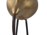 sculpture of a golden shell on a black stand