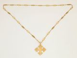 an image of a gold necklace with a cross on it