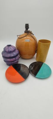 many different colored dishes and cups on the table