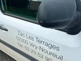 a white van that has a sticker on the side of it