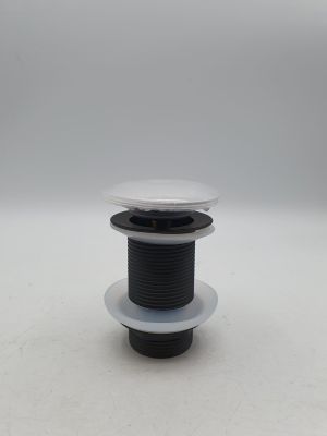 une bobine noire et blanche munie d'un couvercle en plastique, posée sur une surface blanche
