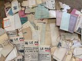 a pile of old papers on the floor of a room