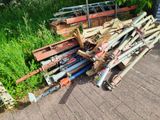 a pile of pipes sitting on the side of the road