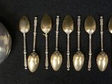 a lot of spoons and spoon spoons sitting on a table