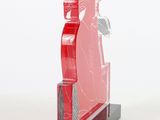 a red sculpture of a woman holding a toothbrush