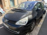 a black van that is parked on the side of the street