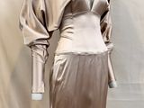 a mannequin with a dress on it on a mannequin stand