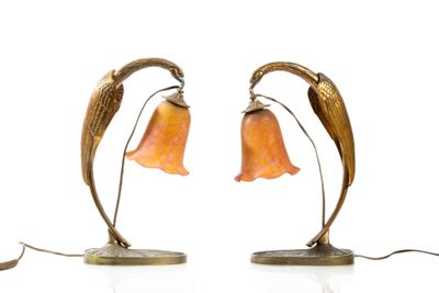 pair of art nouveau style lamps with orange glass flowers on bronze bases