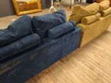 two couches that are sitting on a wooden floor