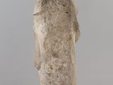 statue of a woman standing on a clear pedestal