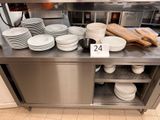 many plates on the counter in the restaurant kitchen