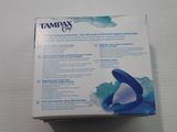 a box of tampax cup sitting on a table