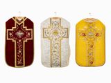 three different colored vests with a cross on them on a white background