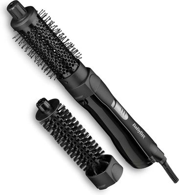 an image of a hair dryer and brush sitting next to each other