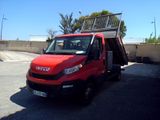 a red truck that is parked in a parking lot
