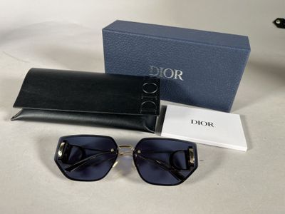 a close up of a pair of sunglasses and a case on a table