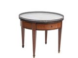 a round table with a marble top and wooden legs