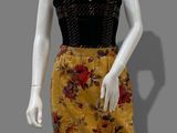 a mannequin wearing a yellow floral skirt and black top