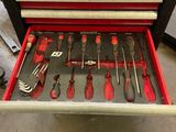 the tool drawer is full of tools in the garage