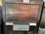 an image of a stainless steel ice machine sitting on a pallet