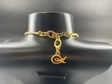 a close up of a necklace on a mannequin with a gold chain