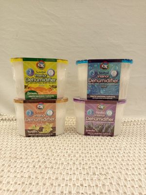 three containers of yogurt sitting on top of a table
