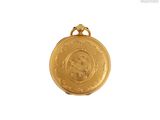 l'image d'une médaille d'or sur laquelle figure le visage d'une femme