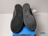 adidas shoes in a box on a white surface