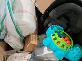 a box full of diapers and toys inside of it