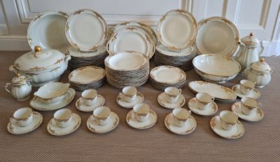 many plates and cups and saucers on the floor