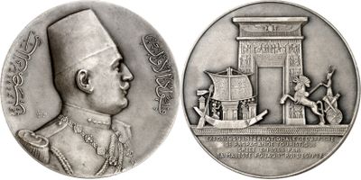 an image of a silver medal with a picture of a man on it