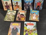 a group of children ' s books on a black surface