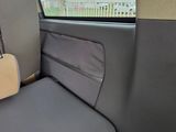 a seat in the back of a car with a guitar on it