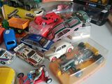 a lot of toy cars that are on a table